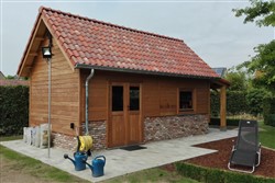 Tuinhuis in hoevestijl met gevelsteen afwerking